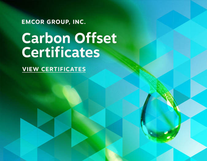 Water droplet on leaf with Carbon Offset Certificates wording